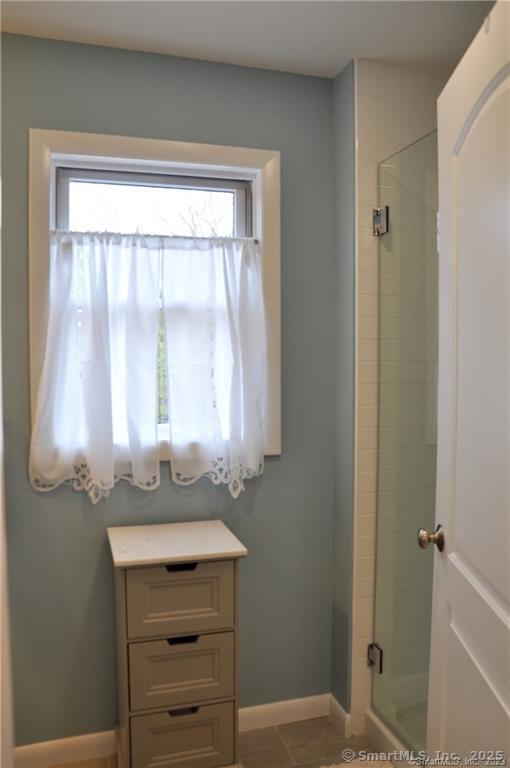 92 High Ridge Road, Unit JUNE 2026 2 Guilford, CT 06437 - Photo 20 of 33 a bathroom with a sink mirror and a window