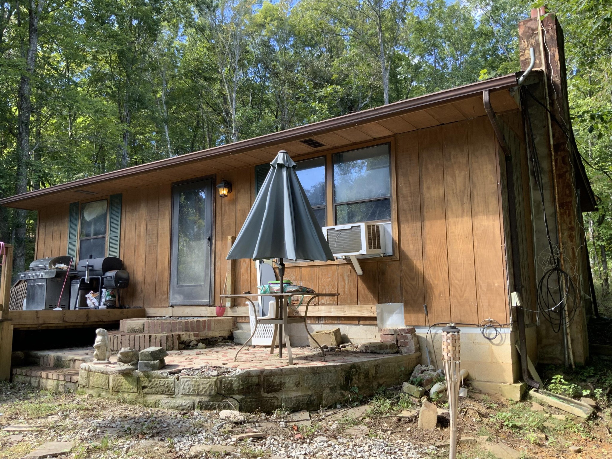 1328 Dogtown Road Ten Mile, TN 37880 - Photo 1 of 16 a view of house with a large windows and lawn chairs