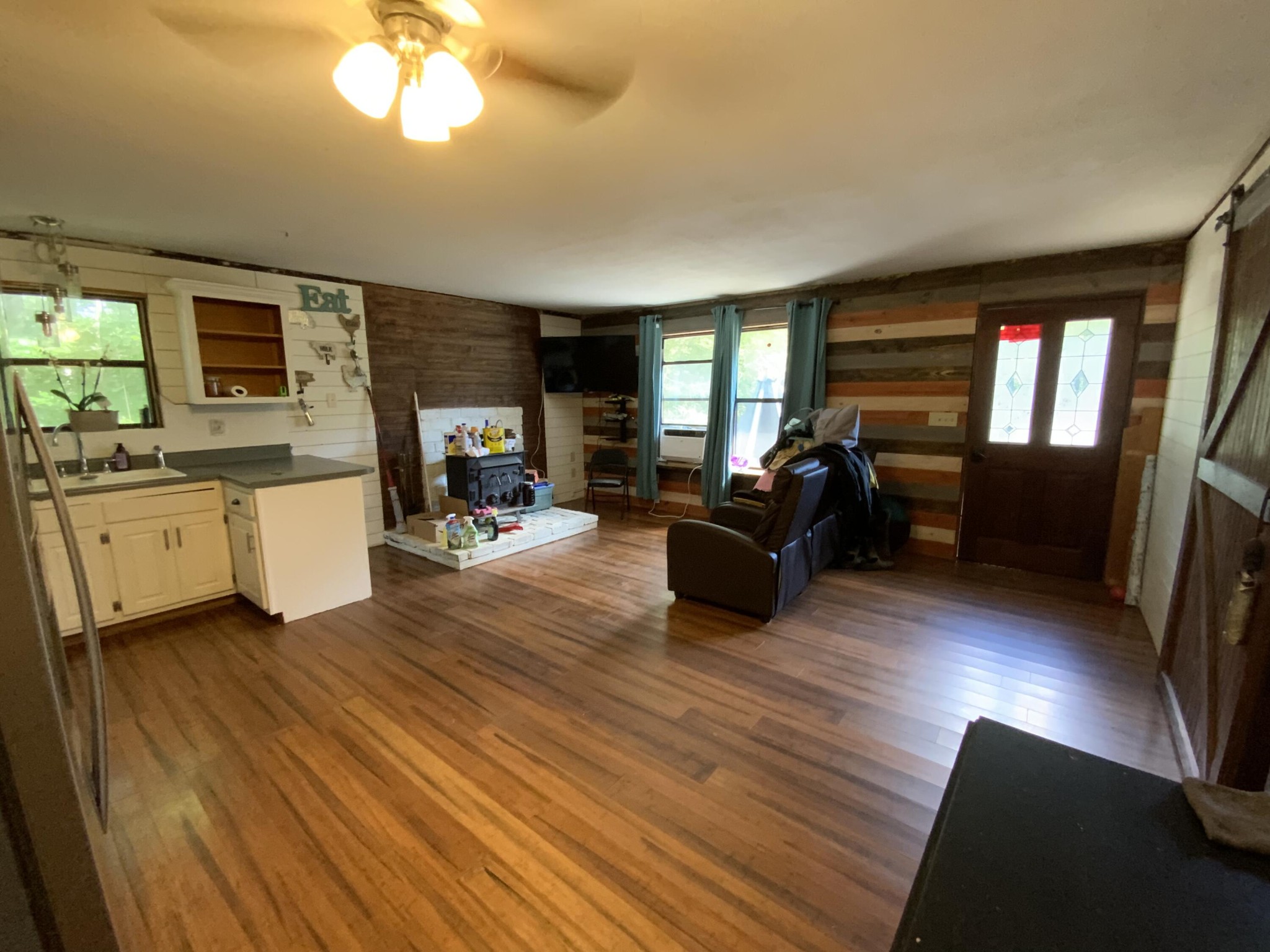 1328 Dogtown Road Ten Mile, TN 37880 - Photo 3 of 16 a living room with furniture a fireplace and a flat screen tv