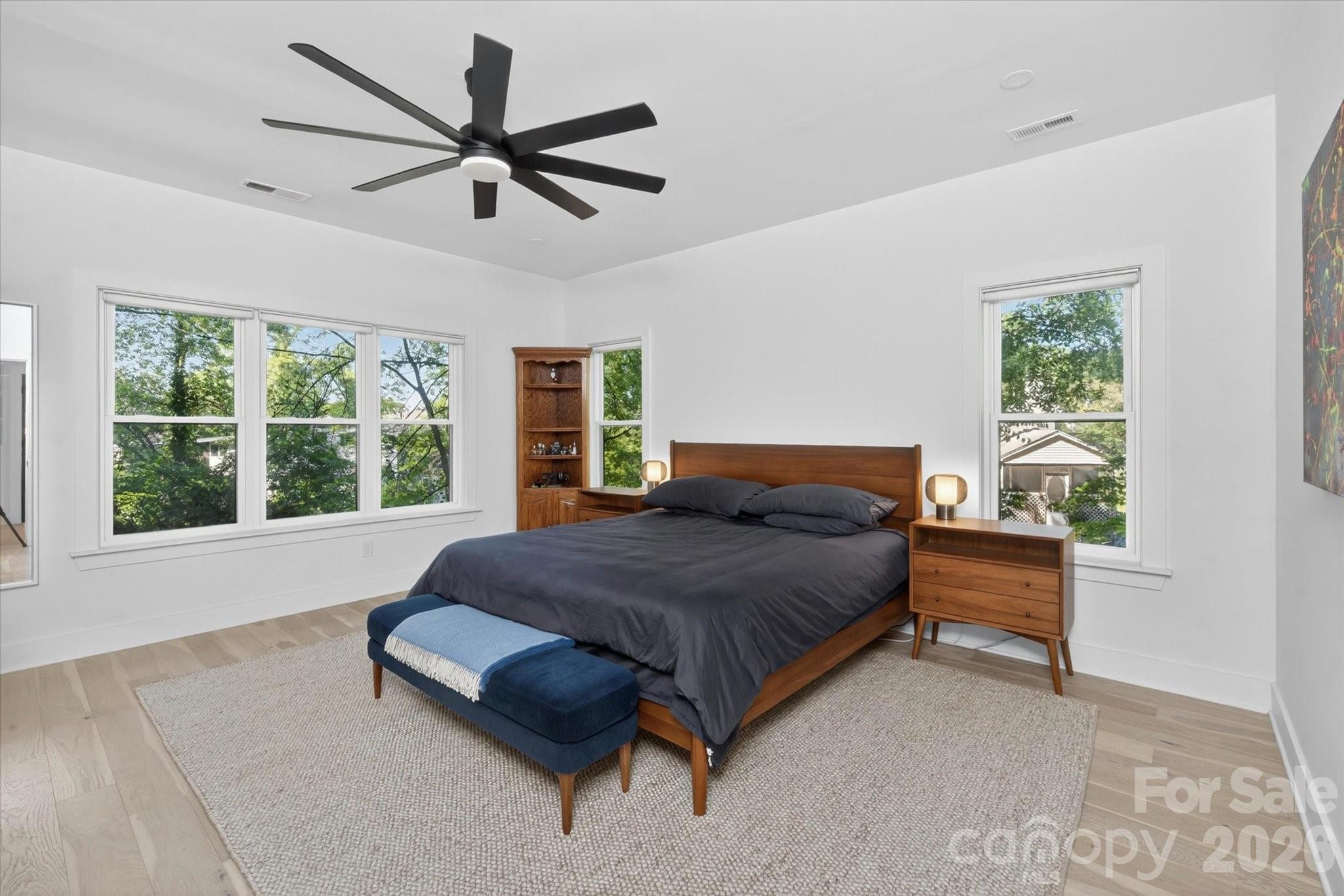 1608 Chippendale Road Charlotte, NC 28205 - Photo 34 of 46 a bedroom with a bed and a large window