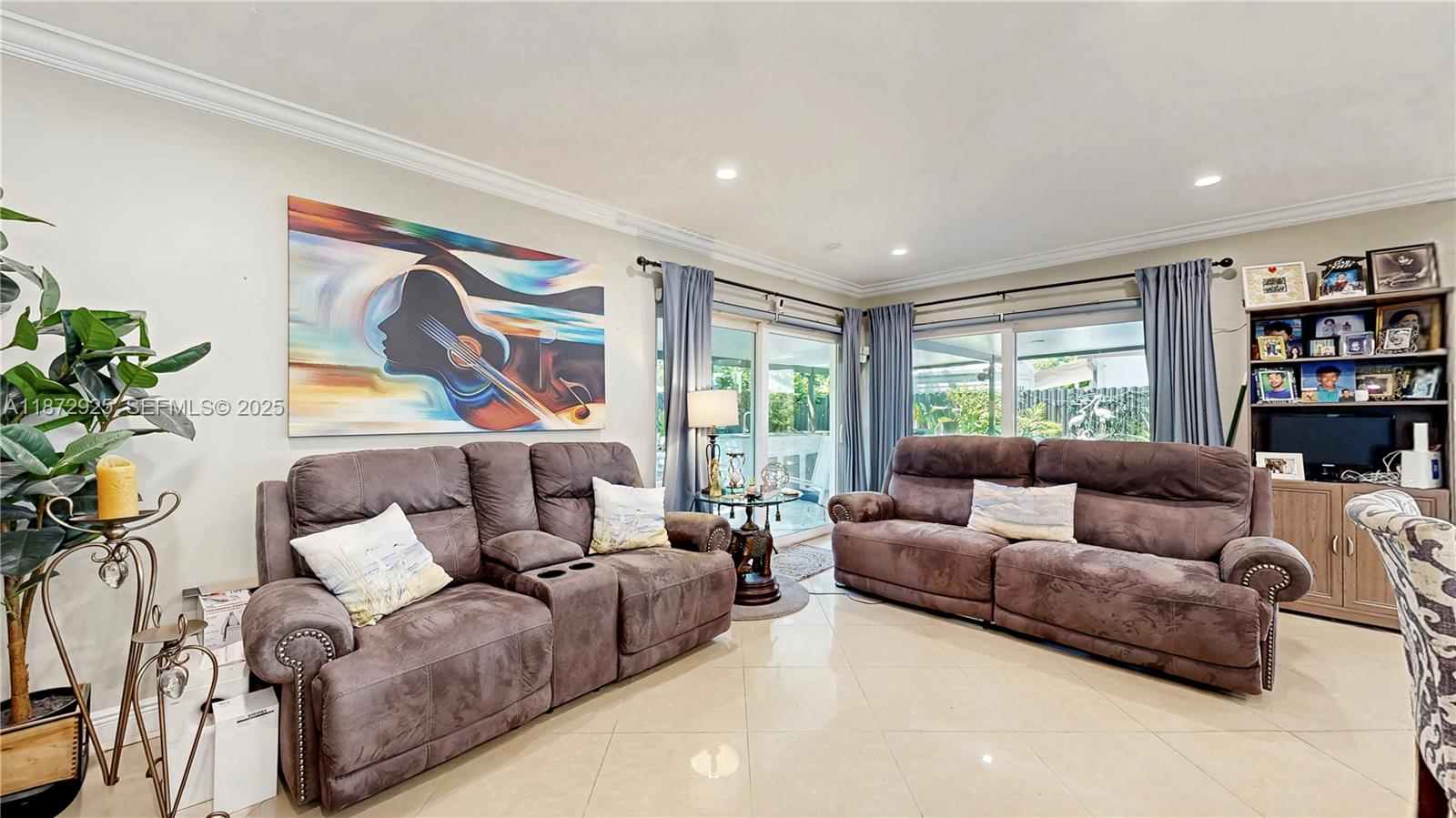 982 Northwest 133rd Court Miami, FL 33182 - Photo 11 of 22 a living room with furniture and a large window