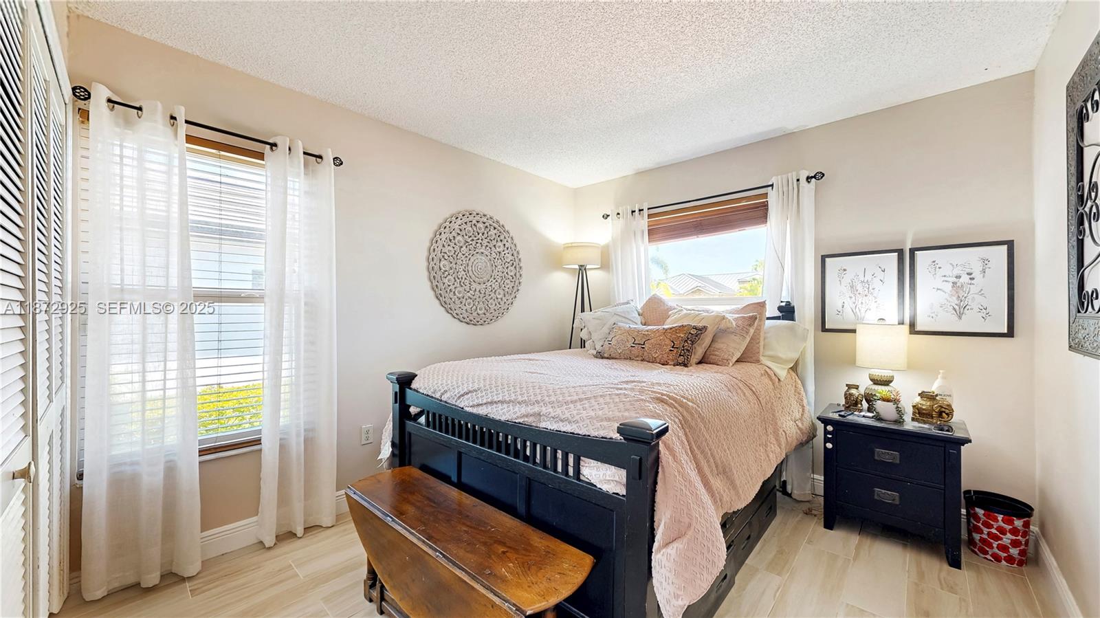 982 Northwest 133rd Court Miami, FL 33182 - Photo 15 of 22 a bed room with a bed and a window