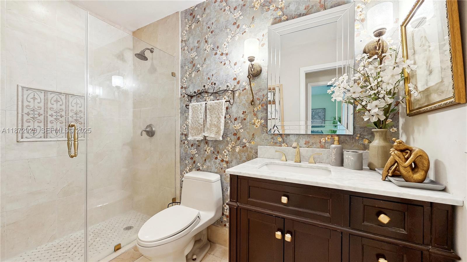 982 Northwest 133rd Court Miami, FL 33182 - Photo 17 of 22 a bathroom with a sink vanity granite toilet and shower