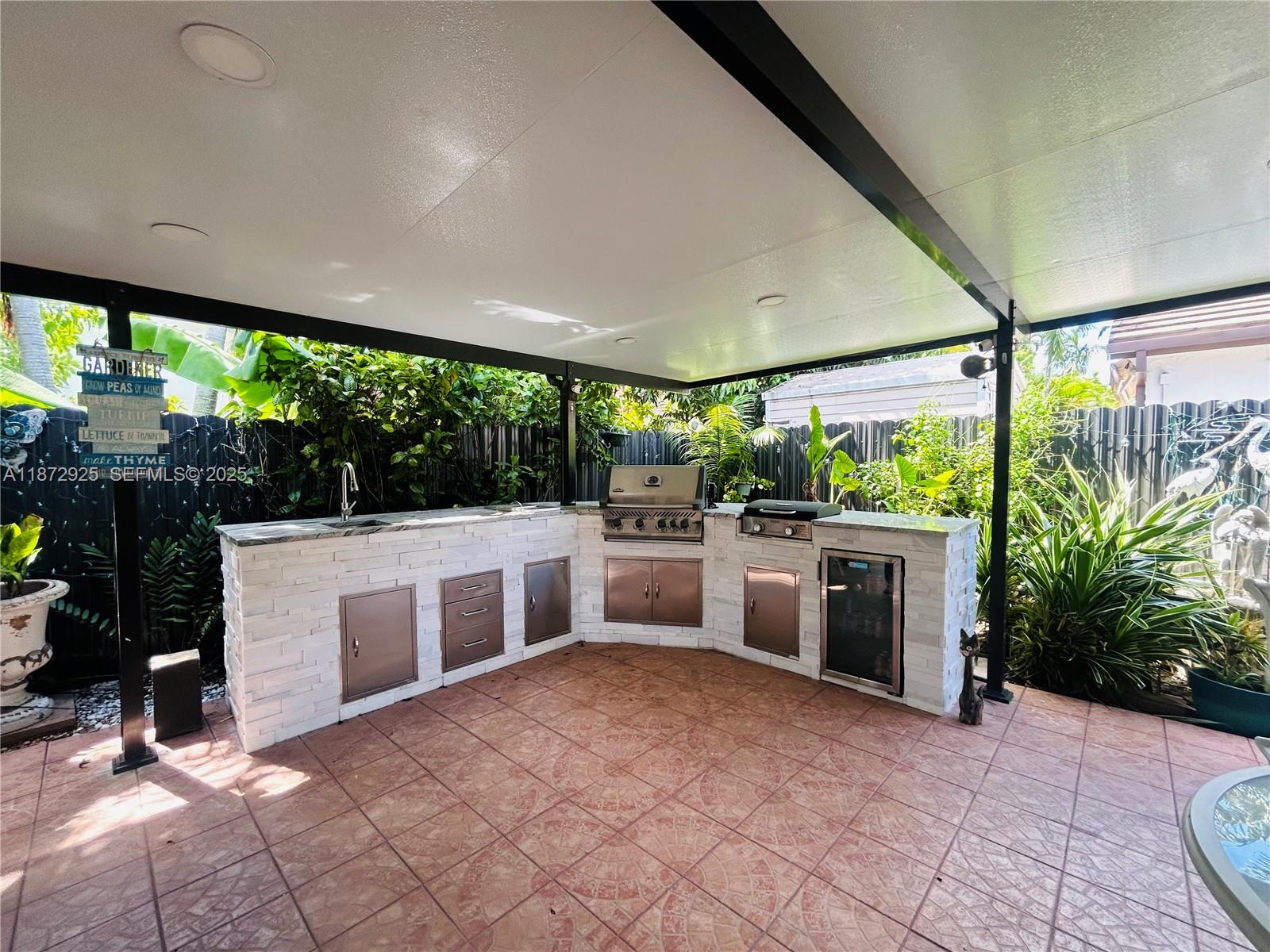 982 Northwest 133rd Court Miami, FL 33182 - Photo 19 of 22 a view of a patio with a stove back yard