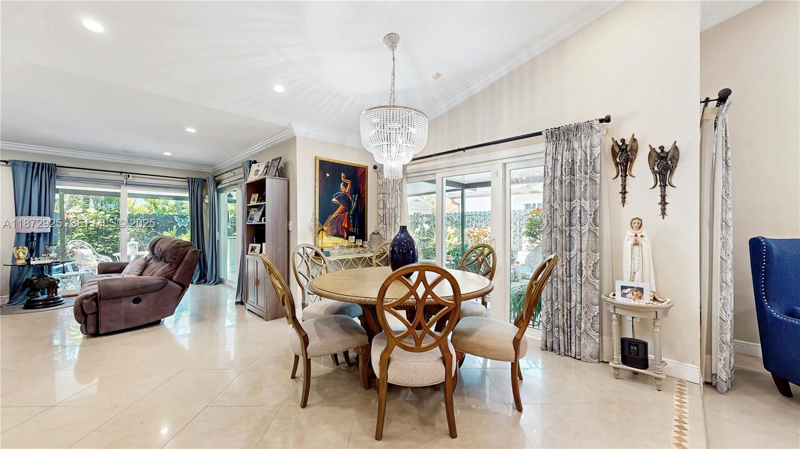 982 Northwest 133rd Court Miami, FL 33182 - Photo 7 of 22 a view of a dining room with furniture large windows and wooden floor