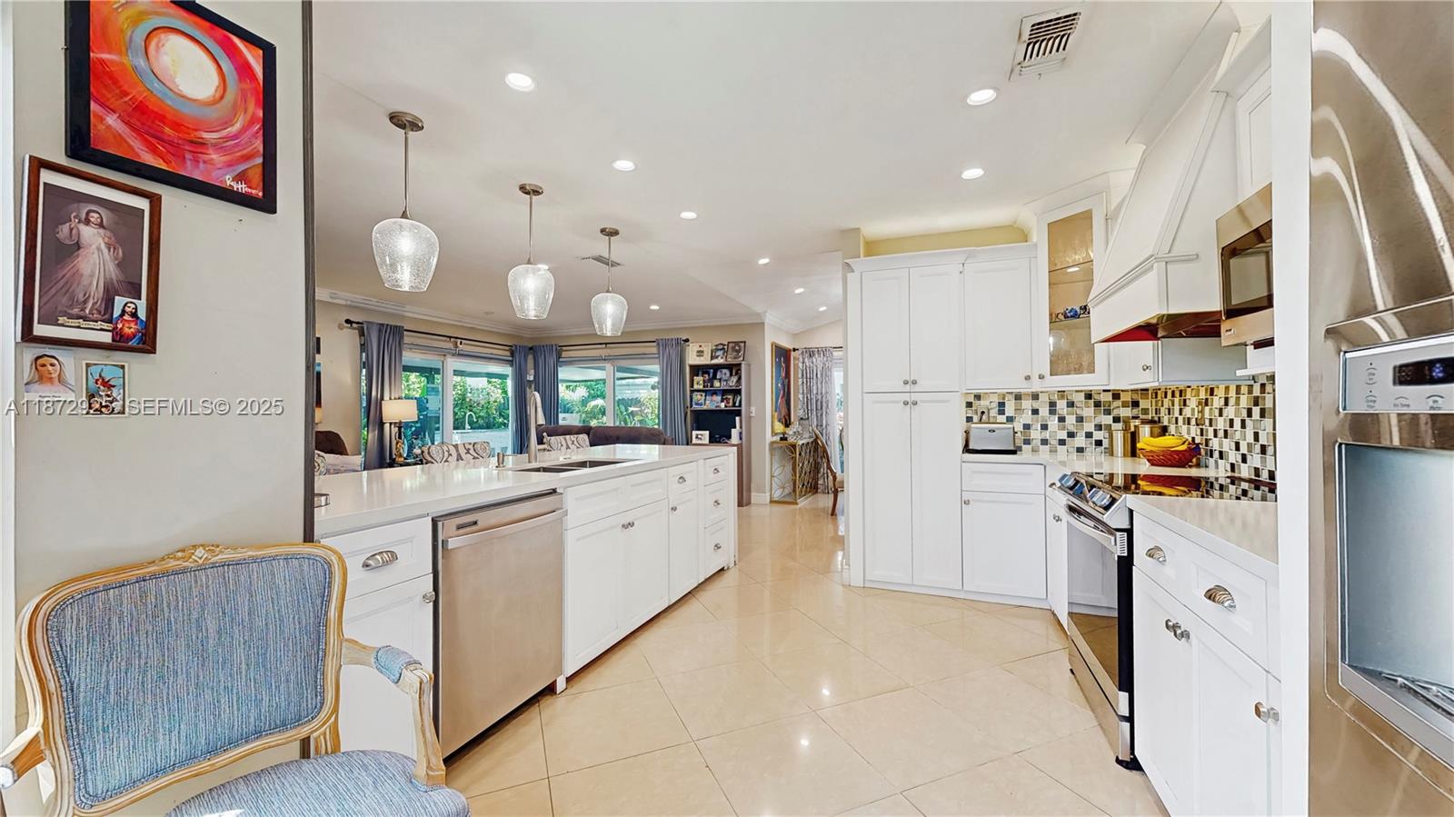 982 Northwest 133rd Court Miami, FL 33182 - Photo 10 of 22 a kitchen with stainless steel appliances granite countertop a refrigerator and a sink