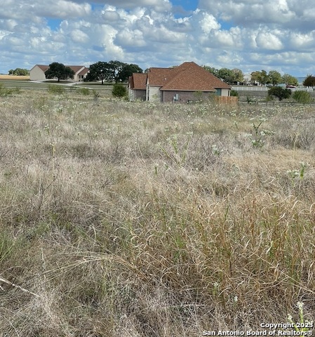 Tbd Martingale Trail Bandera, TX 78003 - Photo 4 of 8 a view of a dry yard with wooden fence