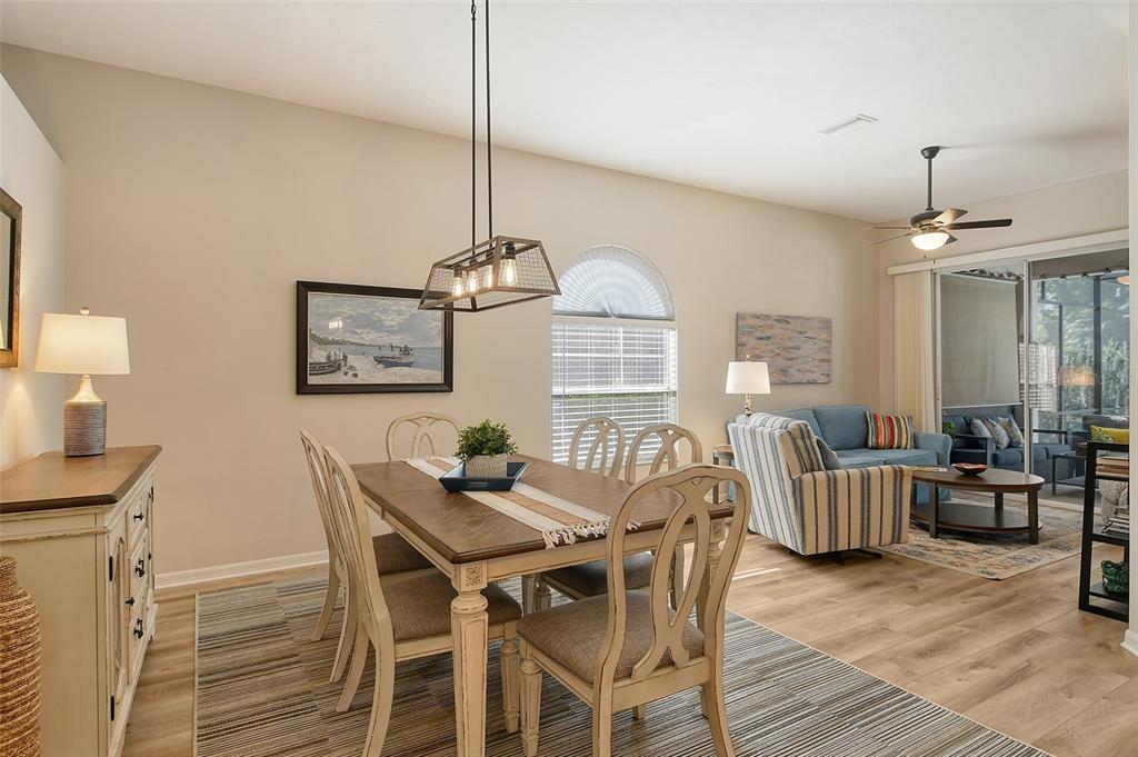 6738 Pleasant Hill Road Bradenton, FL 34203 - Photo 12 of 93 a view of a dining room with furniture window and wooden floor