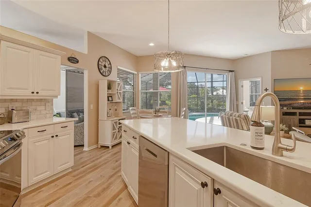 a view of a swimming pool with a patio and a yard