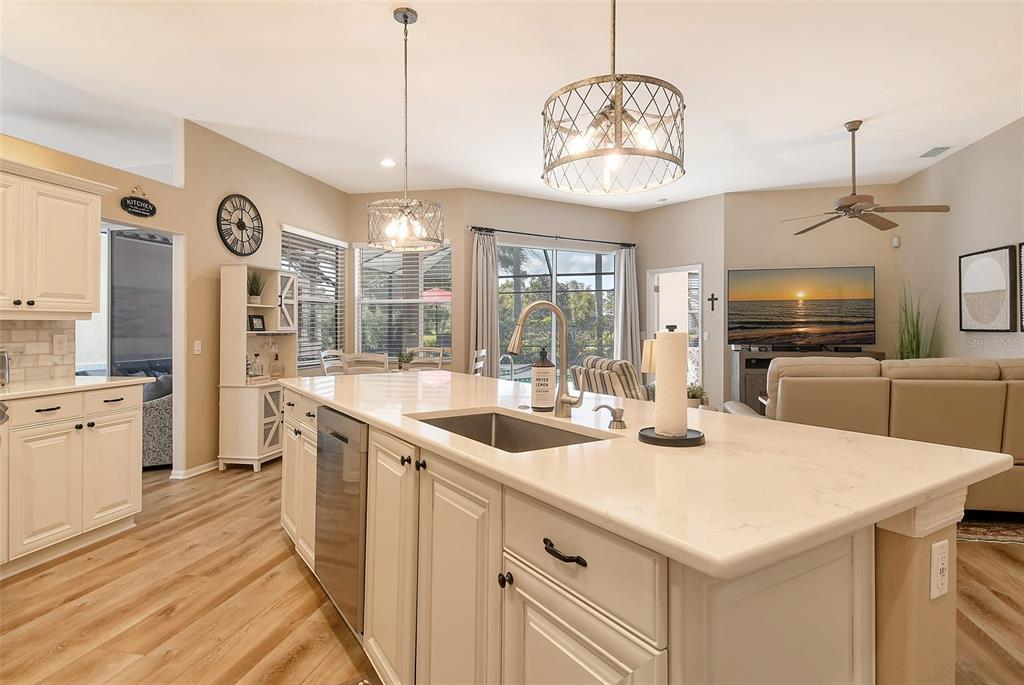 6738 Pleasant Hill Road Bradenton, FL 34203 - Photo 17 of 93 a kitchen with a sink a center island cabinets and stainless steel appliances