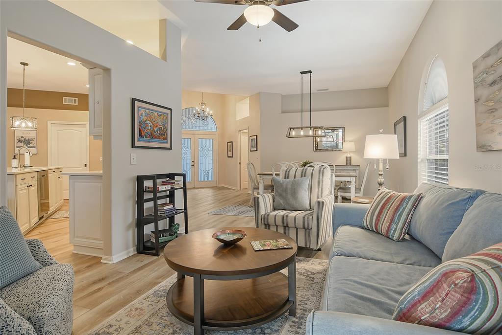 6738 Pleasant Hill Road Bradenton, FL 34203 - Photo 20 of 93 a living room with furniture and a chandelier