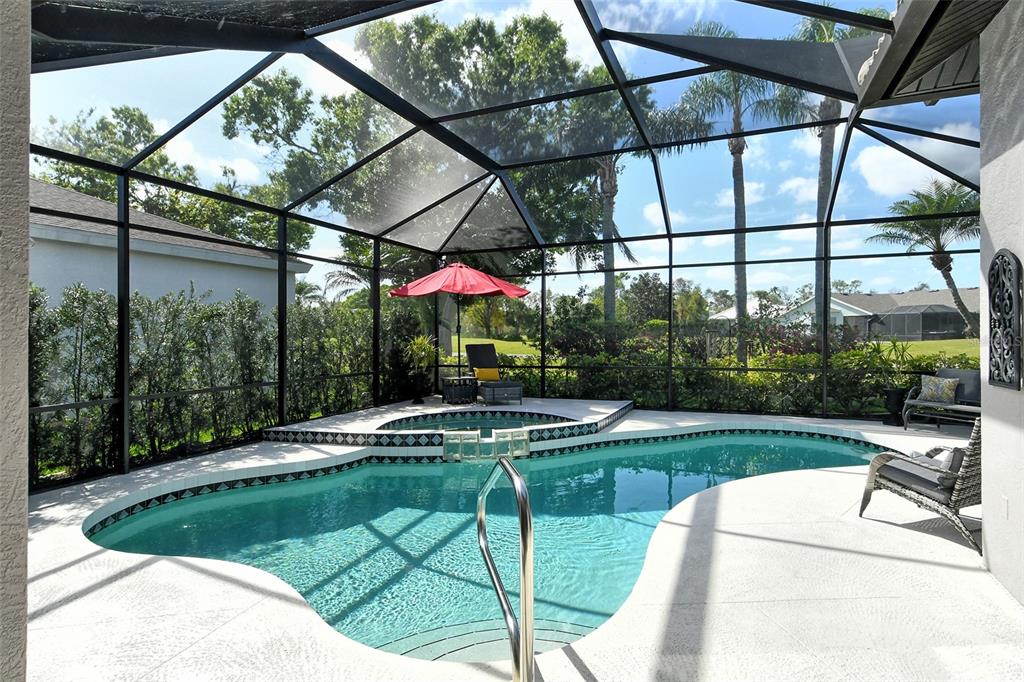 6738 Pleasant Hill Road Bradenton, FL 34203 - Photo 25 of 93 a view of a swimming pool with a patio and a yard