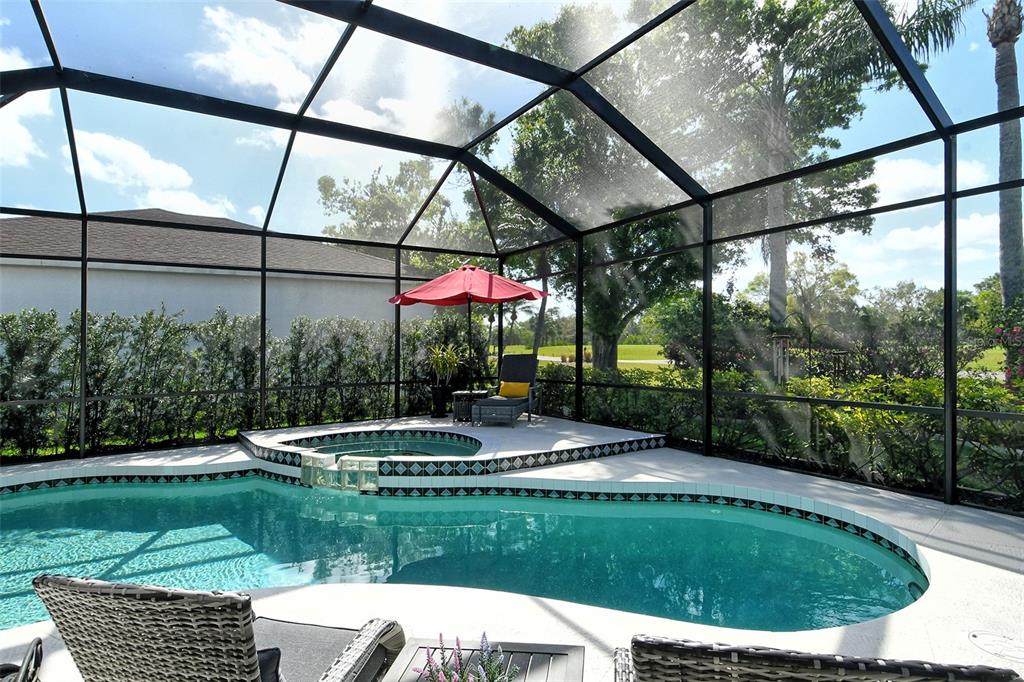 6738 Pleasant Hill Road Bradenton, FL 34203 - Photo 28 of 93 a view of a chair and table in backyard of the house