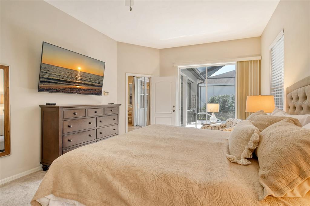 6738 Pleasant Hill Road Bradenton, FL 34203 - Photo 32 of 93 a bedroom with a bed and a flat screen tv
