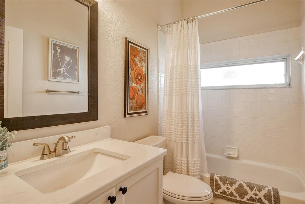 6738 Pleasant Hill Road Bradenton, FL 34203 - Photo 38 of 93 a bathroom with a sink a toilet and shower