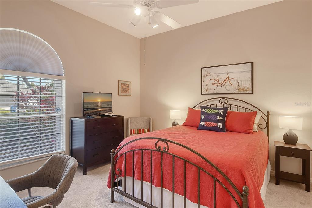 6738 Pleasant Hill Road Bradenton, FL 34203 - Photo 39 of 93 a bedroom with a bed and wooden floor