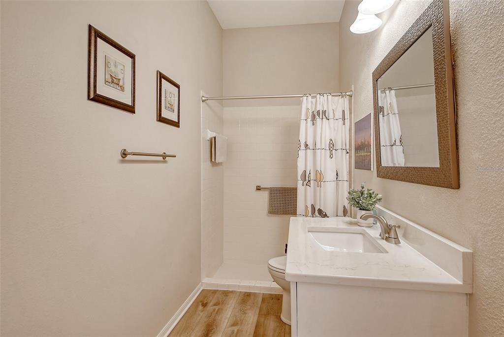 6738 Pleasant Hill Road Bradenton, FL 34203 - Photo 41 of 93 a bathroom with a sink and a mirror