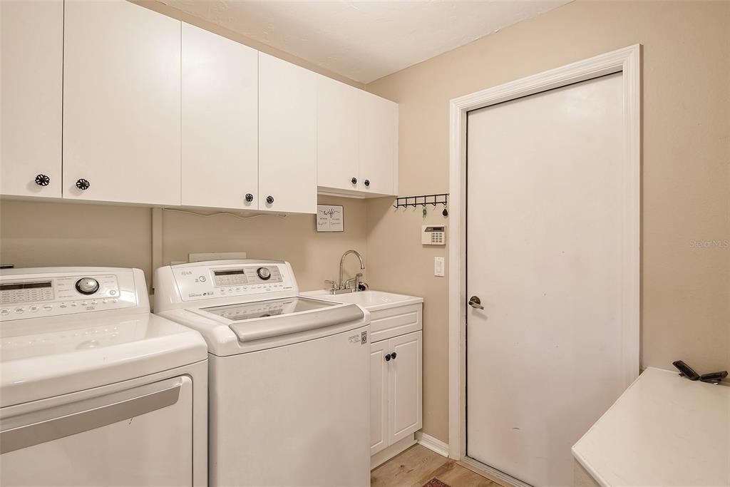 6738 Pleasant Hill Road Bradenton, FL 34203 - Photo 42 of 93 a view of storage and utility room with washer and dryer