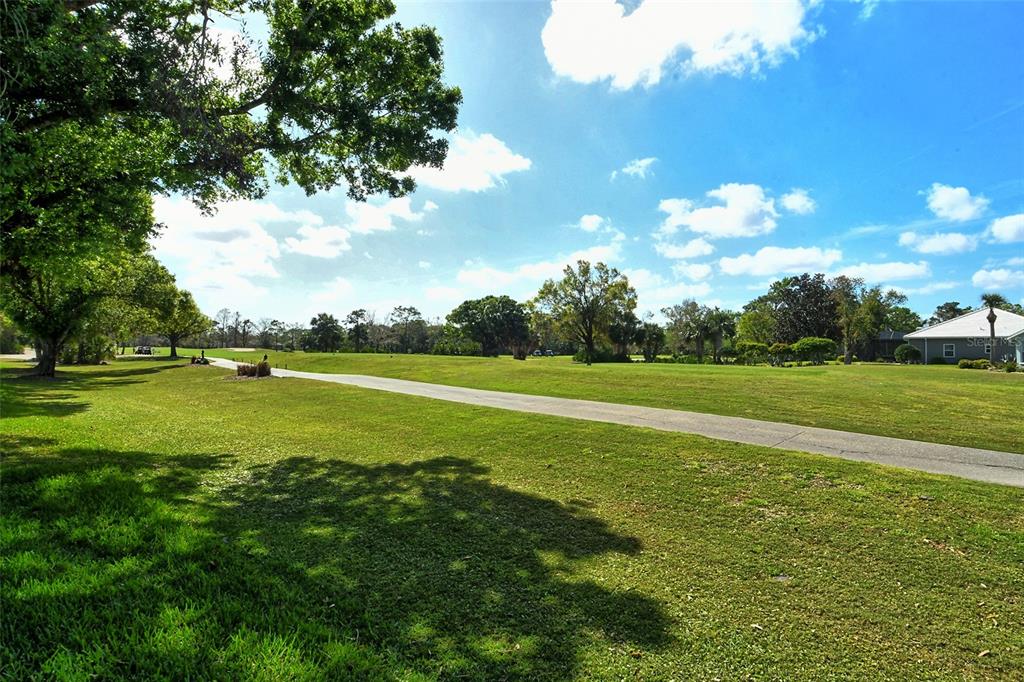 6738 Pleasant Hill Road Bradenton, FL 34203 - Photo 44 of 93 a view of a golf course with a lake