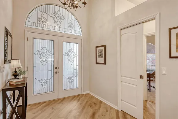 a view of a dining room with furniture and a large window
