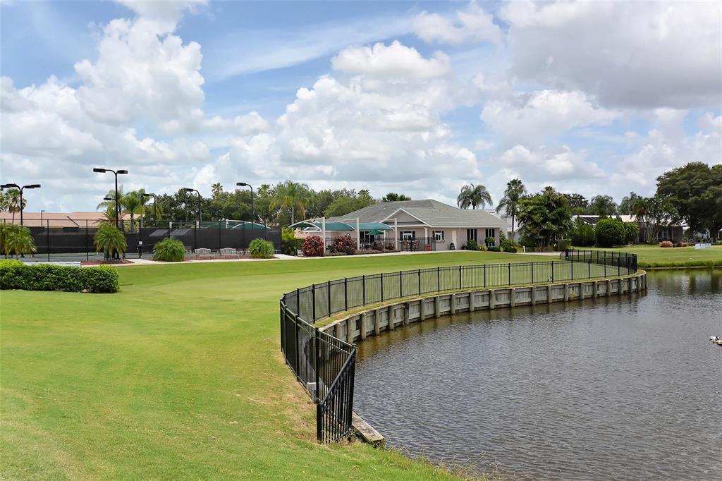 6738 Pleasant Hill Road Bradenton, FL 34203 - Photo 76 of 93 a view of a lake with a garden