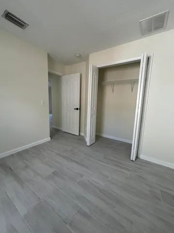 a view of a livingroom with wooden floor
