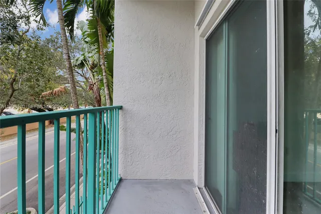 a view of a yard with palm trees