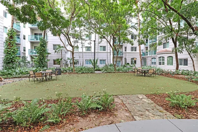 a view of a patio with couches and a fire pit