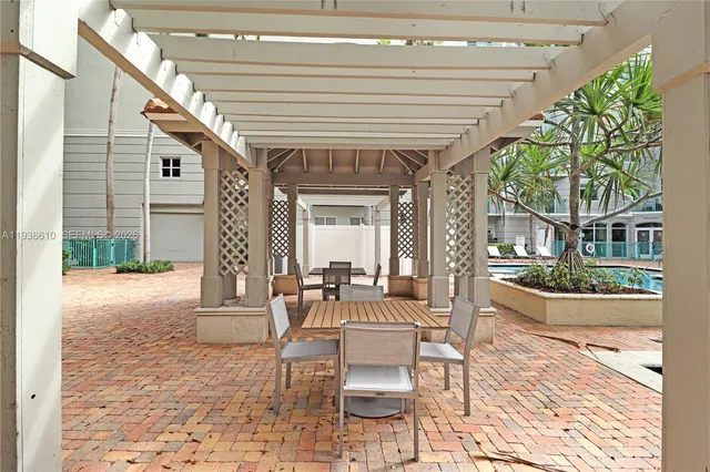 a balcony with table and chairs