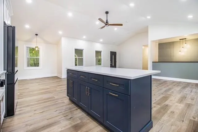 a large bathroom with a large tub and sink