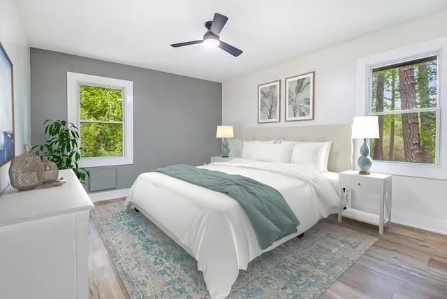 a bedroom with a large bed and a window