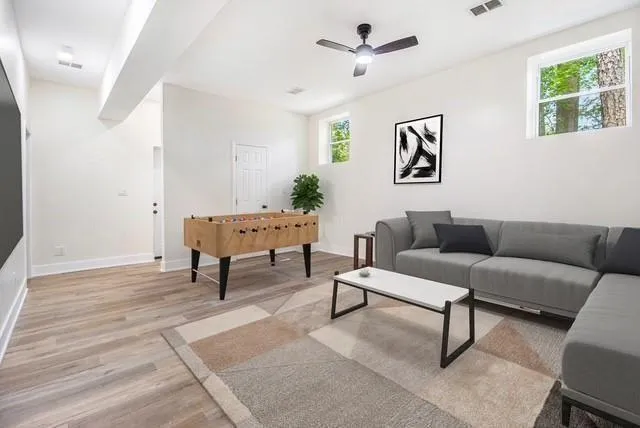 a living room with furniture and a window