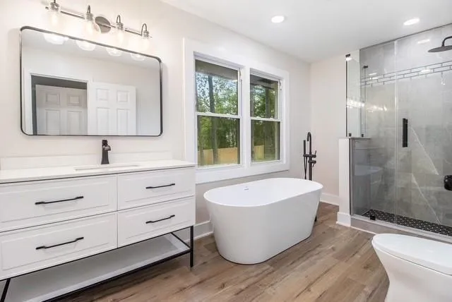 a bathroom with a bathtub and a sink