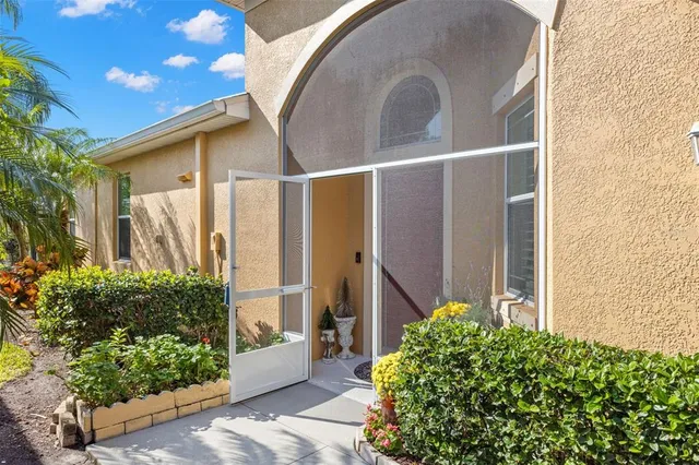 a large kitchen with stainless steel appliances granite countertop a lot of counter space and wooden floors