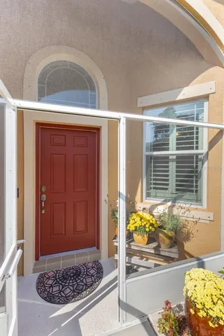 a kitchen with stainless steel appliances granite countertop a refrigerator a sink a stove and cabinets