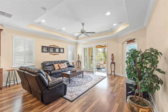 a view of a dining room with furniture large window and wooden floor