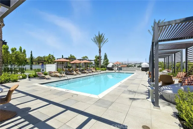 a view of swimming pool with outdoor seating and a terrace