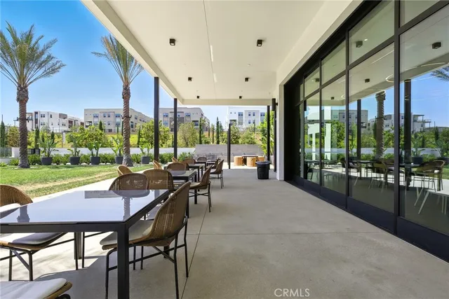 a view of a patio with a dining table and chairs