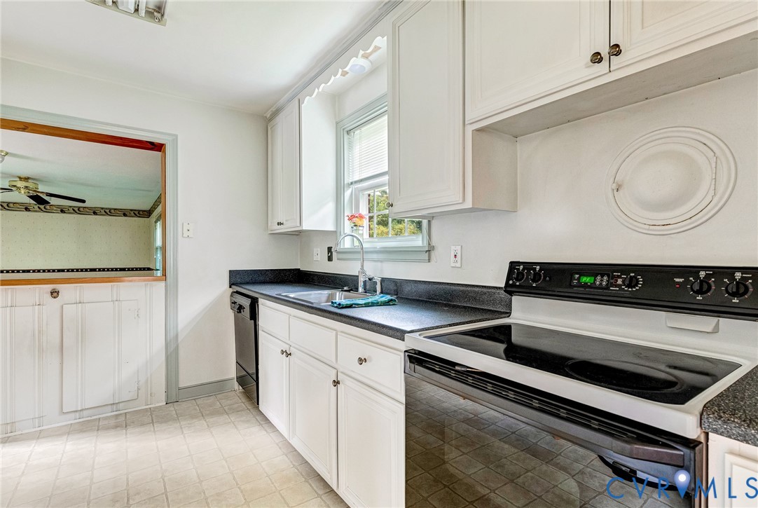 8728 Holly Hill Road Henrico, VA 23229 - Photo 11 of 36 Kitchen with black electric range oven, dark count