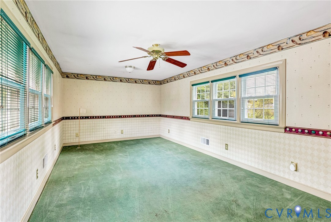 8728 Holly Hill Road Henrico, VA 23229 - Photo 15 of 36 Spare room with wallpapered walls, carpet floors,