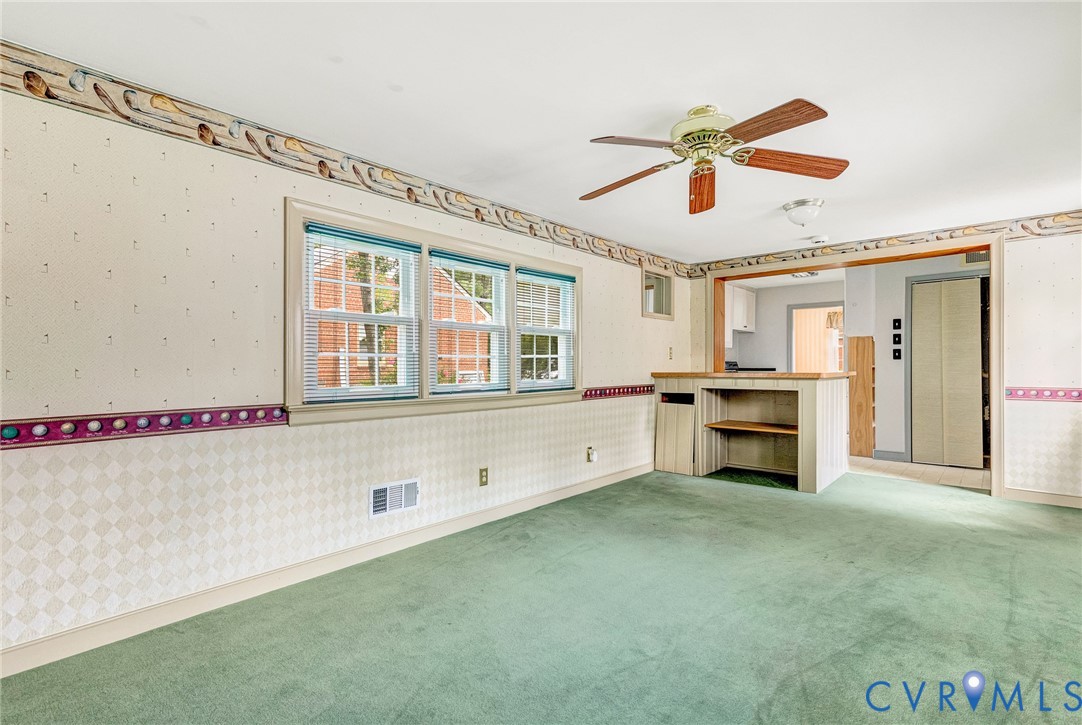 8728 Holly Hill Road Henrico, VA 23229 - Photo 19 of 36 Unfurnished living room with wallpapered walls, ca