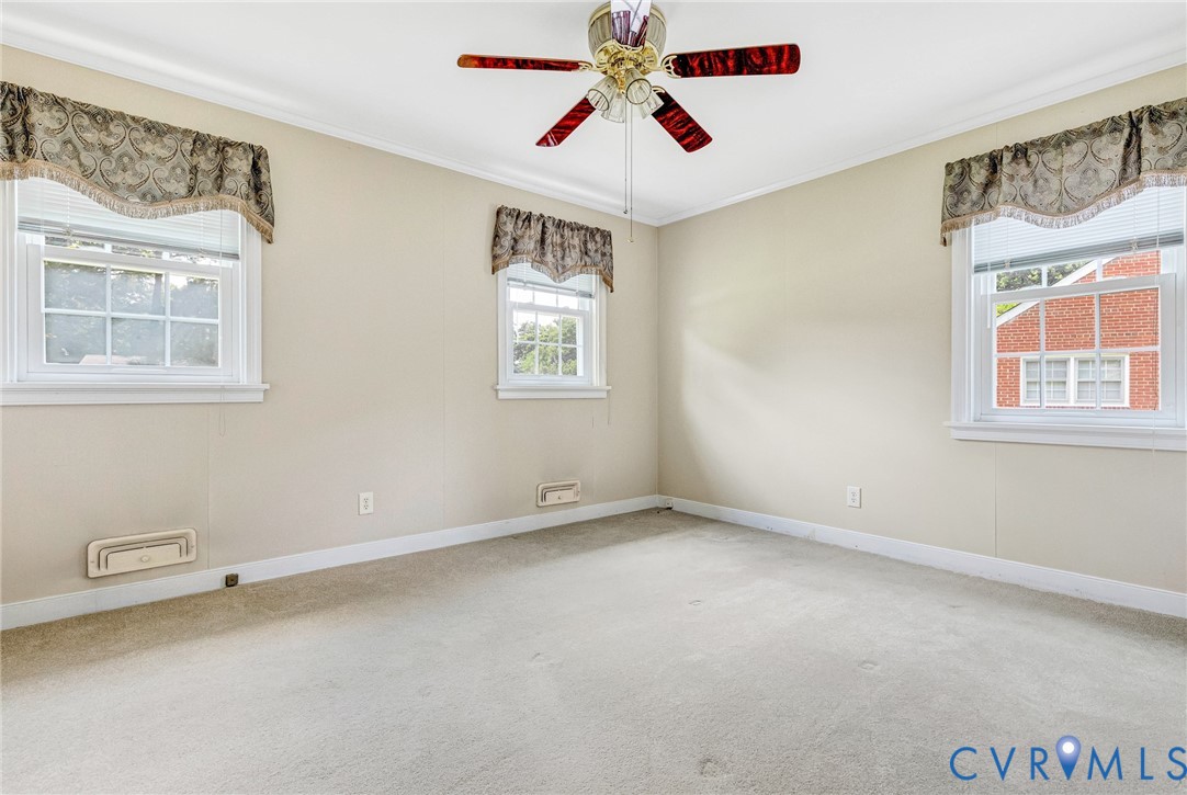 8728 Holly Hill Road Henrico, VA 23229 - Photo 20 of 36 Carpeted empty room featuring plenty of natural li