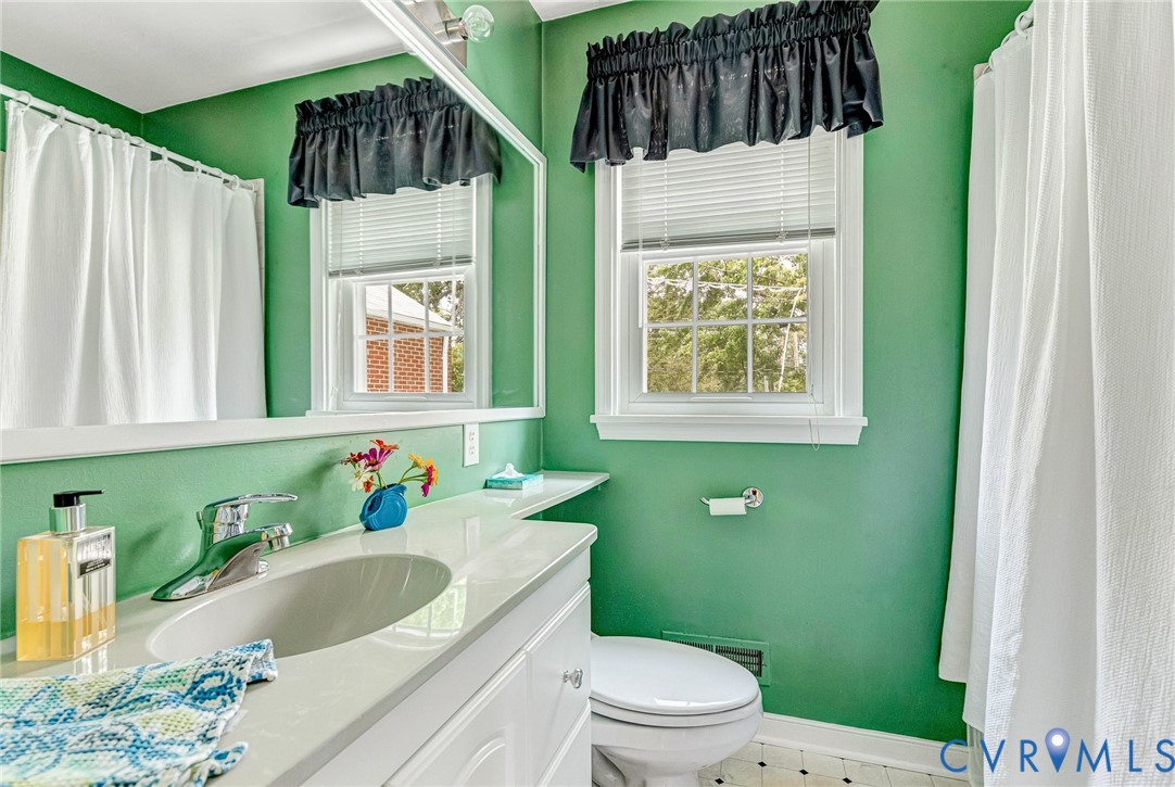 8728 Holly Hill Road Henrico, VA 23229 - Photo 22 of 36 Bathroom with vanity and a shower with curtain