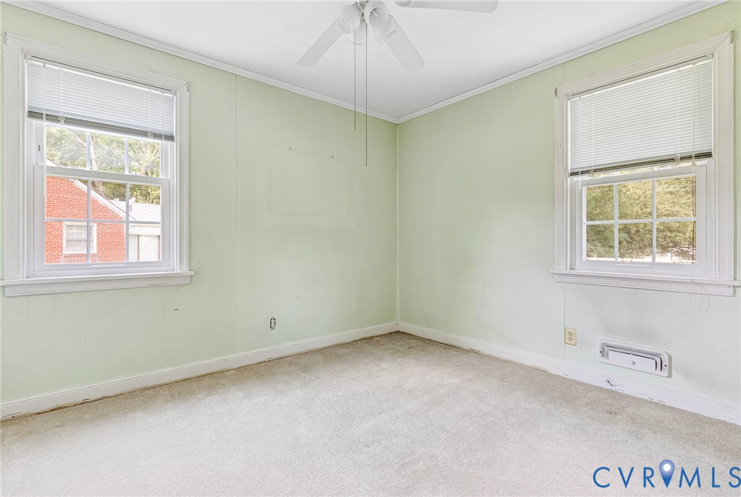 8728 Holly Hill Road Henrico, VA 23229 - Photo 23 of 36 Unfurnished room featuring carpet, crown molding,