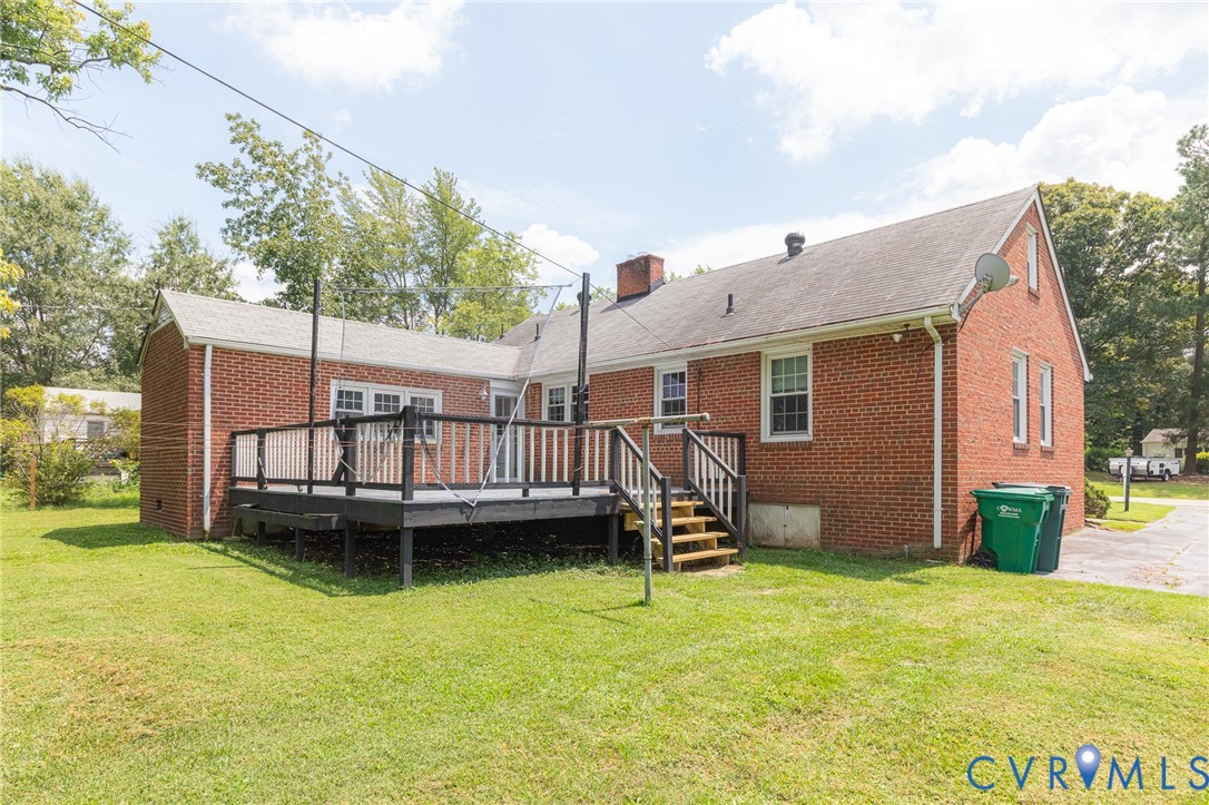 8728 Holly Hill Road Henrico, VA 23229 - Photo 29 of 36 Rear view of property featuring a wooden deck, bri