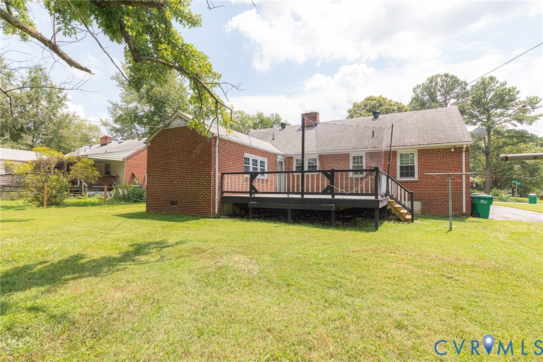 8728 Holly Hill Road Henrico, VA 23229 - Photo 31 of 36 Rear view of house with a wooden deck, brick sidin