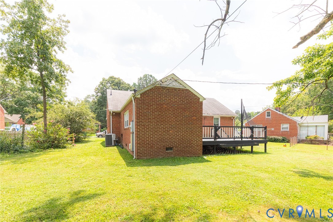 8728 Holly Hill Road Henrico, VA 23229 - Photo 33 of 36 View of grassy yard featuring a wooden deck