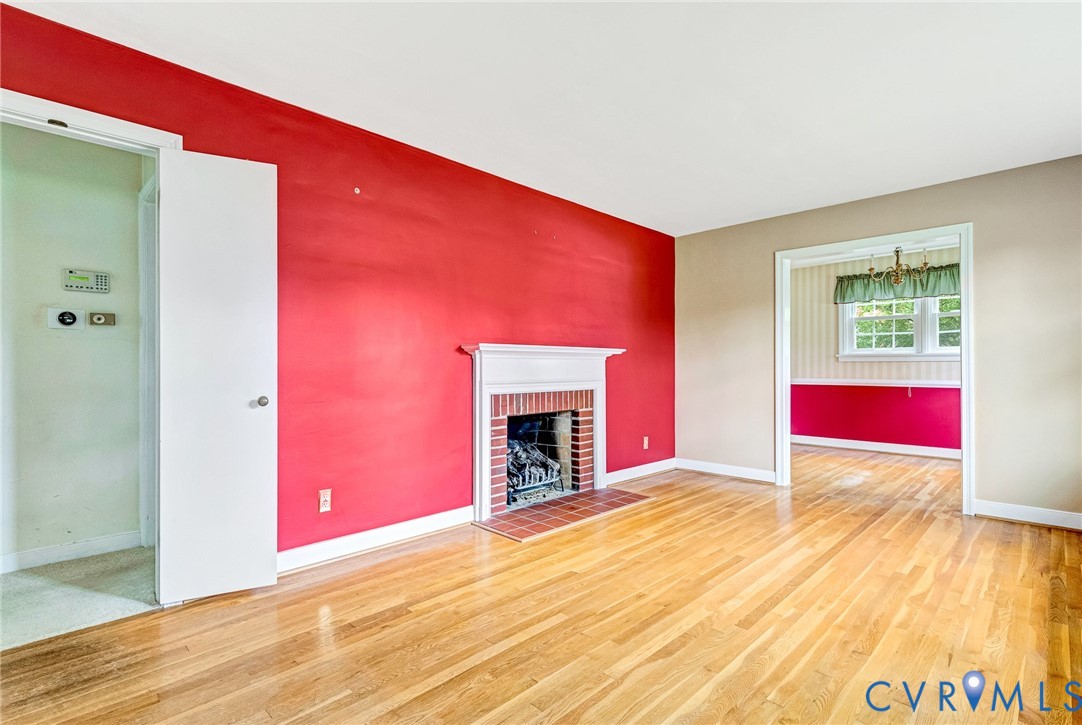 8728 Holly Hill Road Henrico, VA 23229 - Photo 4 of 36 Unfurnished living room featuring wood finished fl