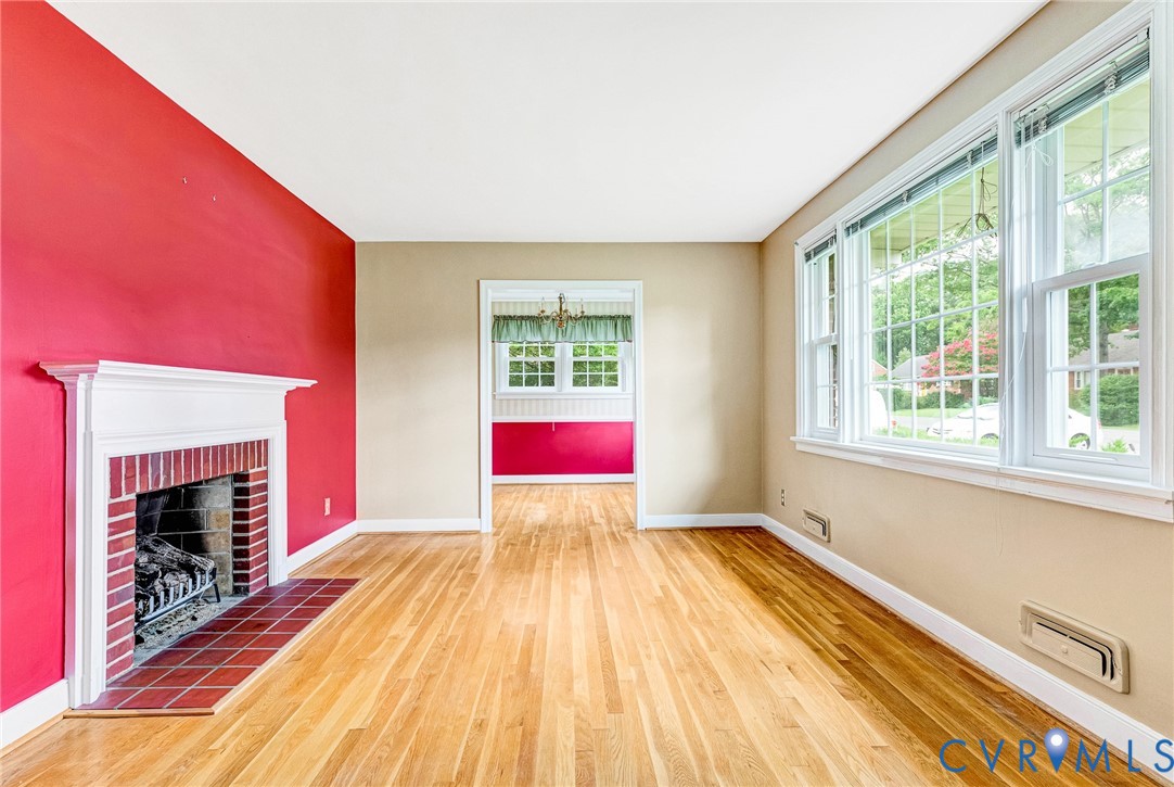 8728 Holly Hill Road Henrico, VA 23229 - Photo 5 of 36 Unfurnished living room featuring wood finished fl