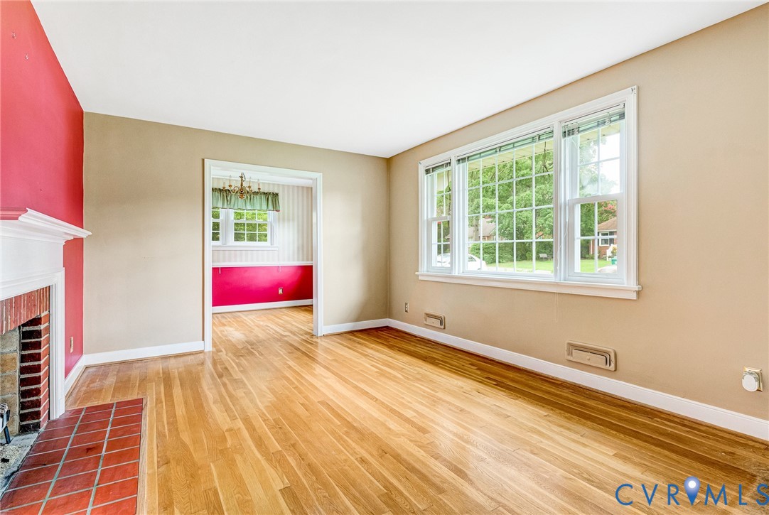 8728 Holly Hill Road Henrico, VA 23229 - Photo 6 of 36 Unfurnished living room featuring wood finished fl